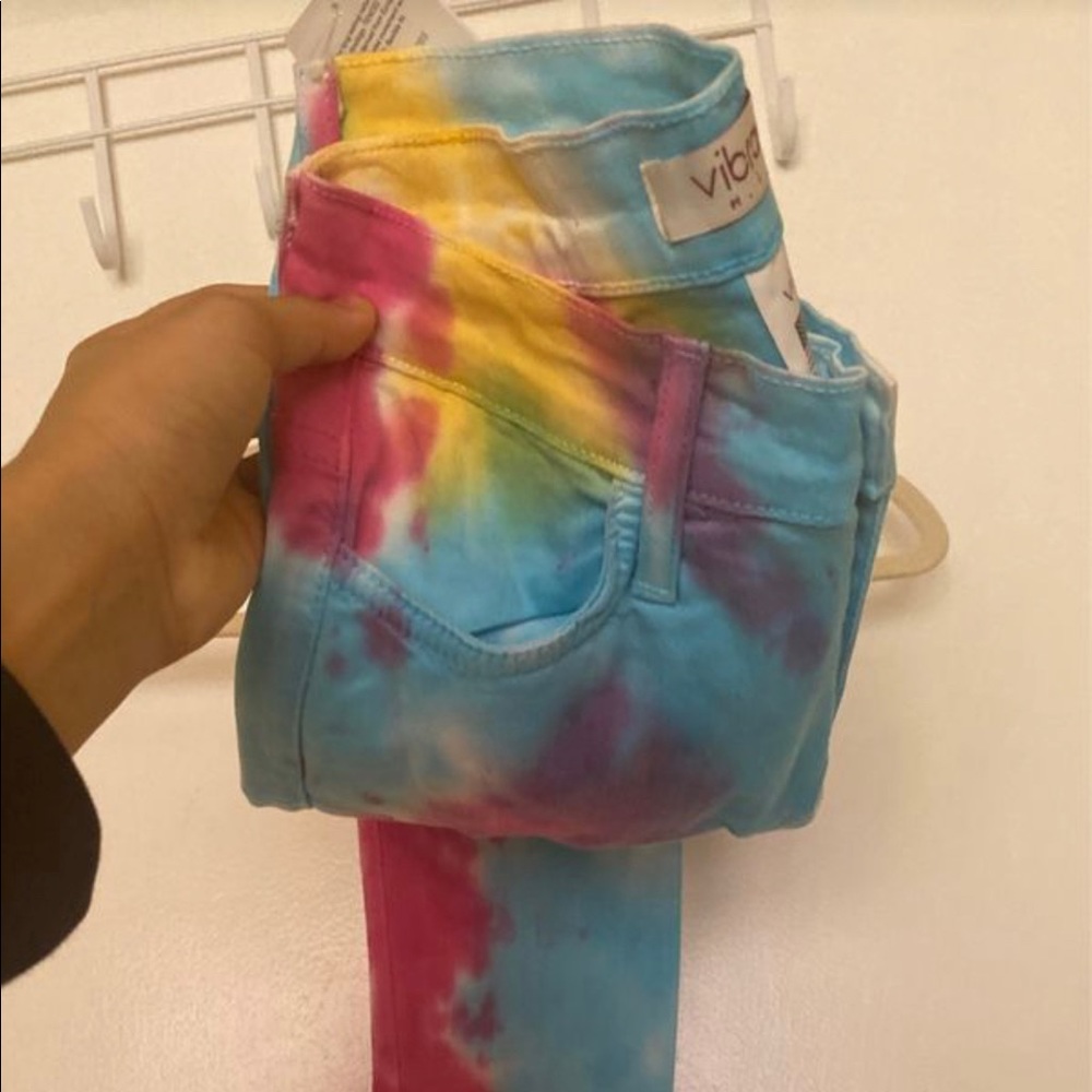 Vibrant ripped tie dye jeans